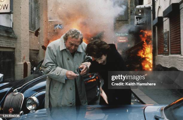 American actress Sean Young as Stacy Mansdorf and British actor Michael Caine as former secret agent Harry Anders in the film 'Blue Ice', 1992. In...