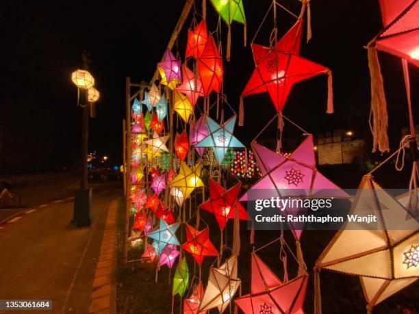 the beauty of traditional thai patterns on traditional thai lanterns at nighttime. - cidade de chiang mai imagens e fotografias de stock