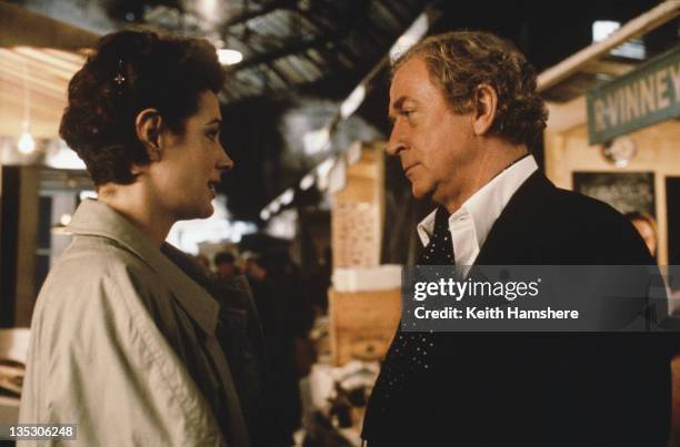 American actress Sean Young as Stacy Mansdorf and British actor Michael Caine as former secret agent Harry Anders in the film 'Blue Ice', filmed on...