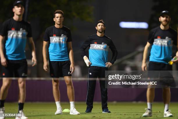 Devon Conway , Kane Williamson and Mitchell Santner during the New Zealand nets session prior to the ICC Men's T20 World Cup final match between New...