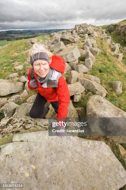 walking hadrian's wall at limestone corner, england - northumberland stock pictures, royalty-free photos & images