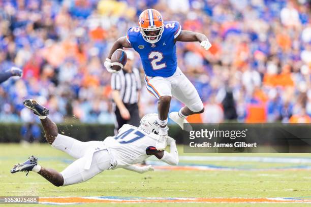 Kemore Gamble of the Florida Gators hurtles Chris Edmonds of the Samford Bulldogs during the first quarter of a game at Ben Hill Griffin Stadium on...