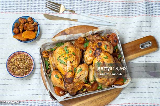 roasted chicken stuffed with dried fruit - stuffing food stock pictures, royalty-free photos & images