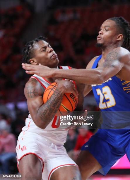 Marcus Sasser of the Houston Cougars drives to the basket during the second half against Kvonn Cramer of the Hofstra Pride at Fertitta Center on...