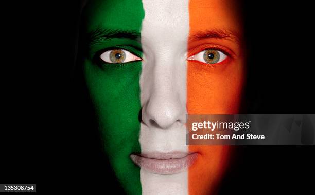 irish man with flag of ireland on face - republic of ireland flag stock pictures, royalty-free photos & images