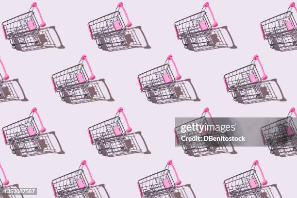 pink and metal shopping cart pattern, with hard shadow, on white background. shopping, discounts, opportunities and black friday concept. - madrid shopping stock pictures, royalty-free photos & images