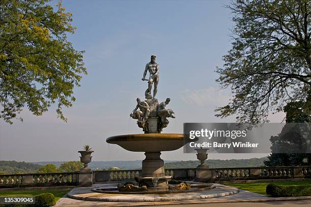 fountain with sculpture against blue sky. - tarrytown stock-fotos und bilder