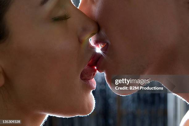 close-up of couple kissing - kissing mouth stock pictures, royalty-free photos & images