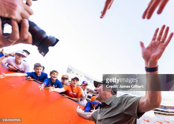 Head coach Dan Mullen of the Florida Gators celebrates with fans after defeating the Samford Bulldogs 70-52 in a game at Ben Hill Griffin Stadium on...