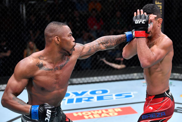 Khaos Williams punches Miguel Baeza in a welterweight fight during the UFC Fight Night event at UFC APEX on November 13, 2021 in Las Vegas, Nevada.