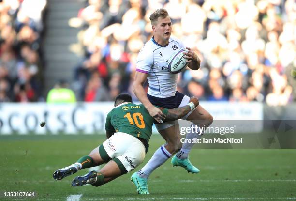 Elton Jantgies of South Africa tackles Duhan van der Merwe of Scotland during the Autumn Nations Series match between Scotland and South Africa at...