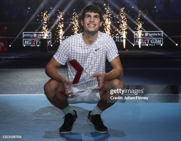 Carlos Alcaraz of Spain celebrates with the trophy after his win over Sebastian Korda of USA in the final match during Day Five of the Next Gen ATP...