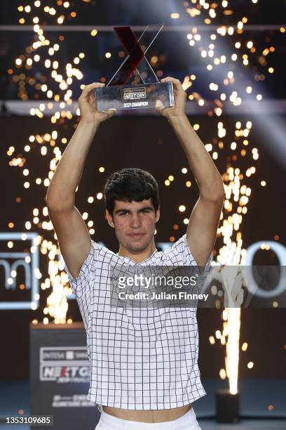 Carlos Alcaraz of Spain celebrates with the trophy after his win over Sebastian Korda of USA in the final match during Day Five of the Next Gen ATP...