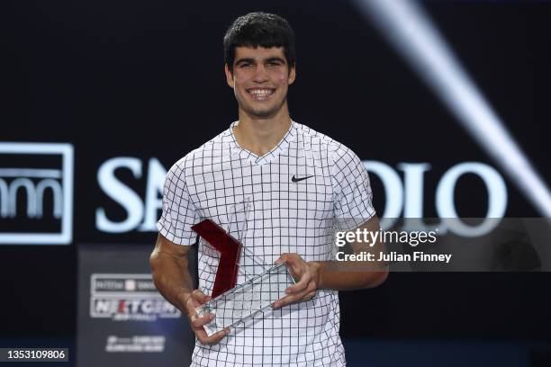 Carlos Alcaraz of Spain celebrates with the trophy after his win over Sebastian Korda of USA in the final match during Day Five of the Next Gen ATP...