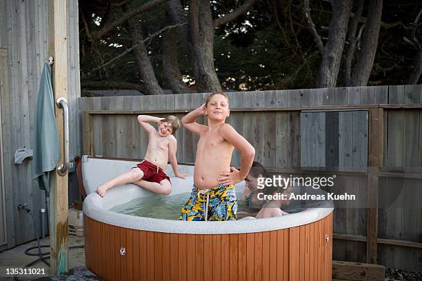 kids having fun inside a hot tub. - tween girls hot imagens e fotografias de stock