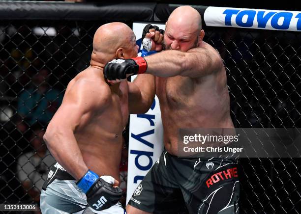 Marcos Rogerio de Lima of Brazil and Ben Rothwell trade punches in a heavyweight fight during the UFC Fight Night event at UFC APEX on November 13,...