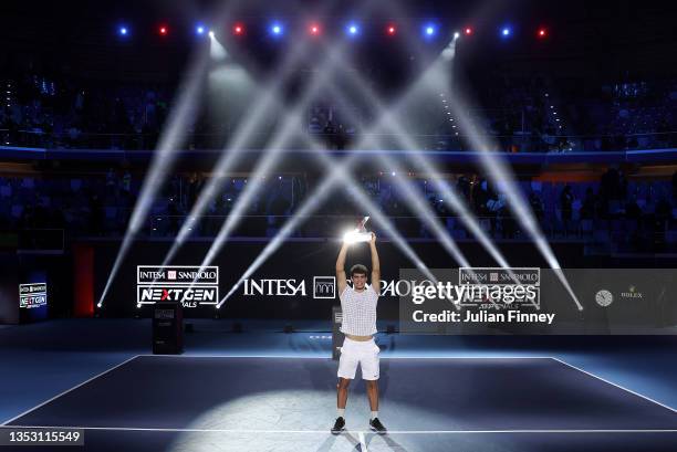 Carlos Alcaraz of Spain celebrates with the trophy after his win over Sebastian Korda of USA in the final match during Day Five of the Next Gen ATP...