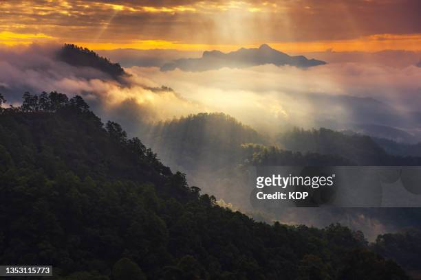 landscape nature aerial view of mountain range with dramatic sky during sunrise. - green inspiring backgrounds fotografías e imágenes de stock