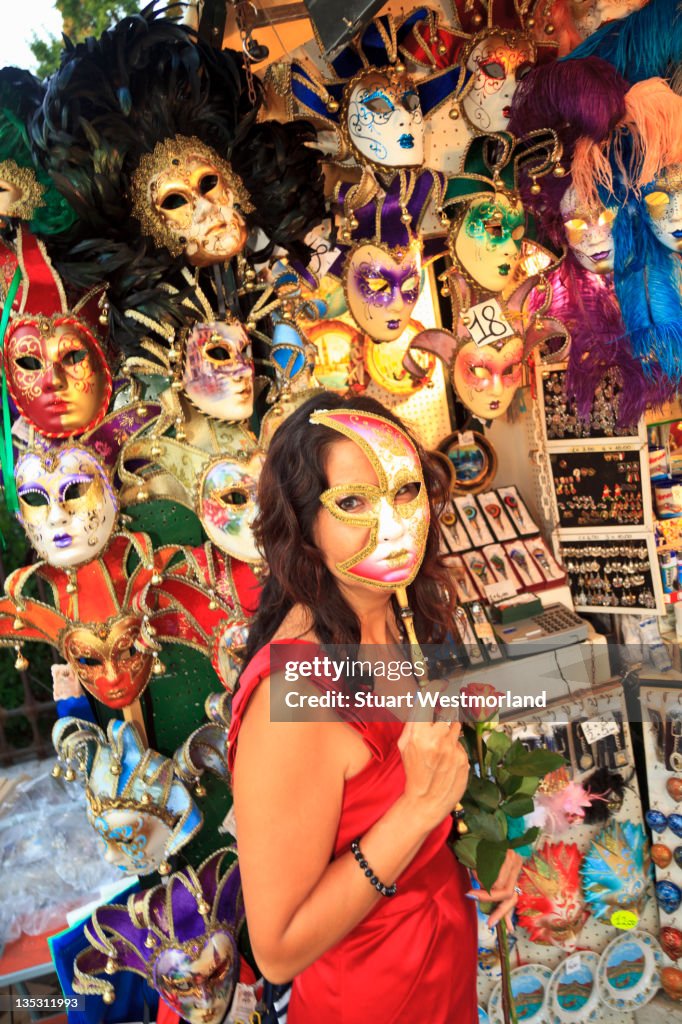 Tourist with Venetian Mask
