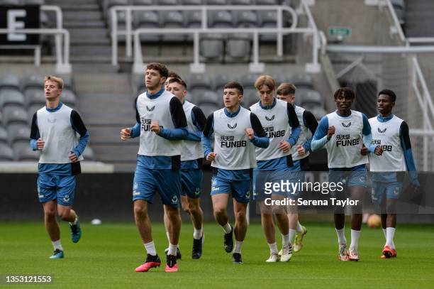 Players warm up during the Newcastle United training session at St.James' Park on November 13, 2021 in Newcastle upon Tyne, England.