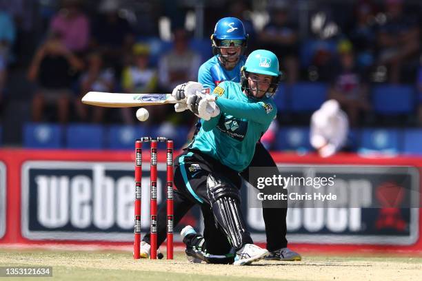 Georgia Redmayne of the Heat bats during the Women's Big Bash League match between the Brisbane Heat and the Adelaide Strikers at Great Barrier Reef...