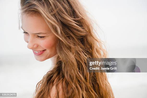 young woman at beach - introvert stock pictures, royalty-free photos & images