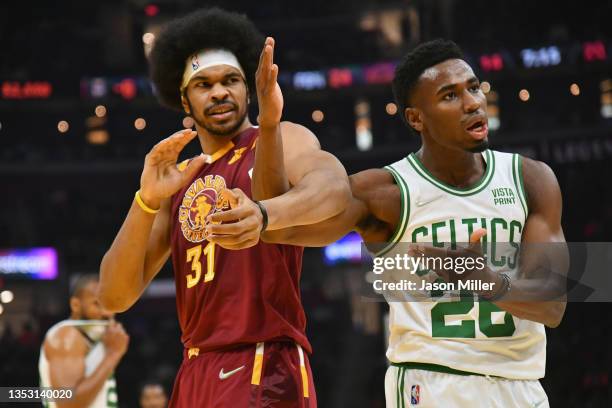 Jarrett Allen of the Cleveland Cavaliers and Aaron Nesmith of the Boston Celtics get tangled up during the first half at Rocket Mortgage Fieldhouse...