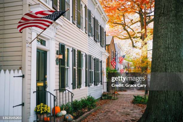 row of townhouses - american flag house stock pictures, royalty-free photos & images