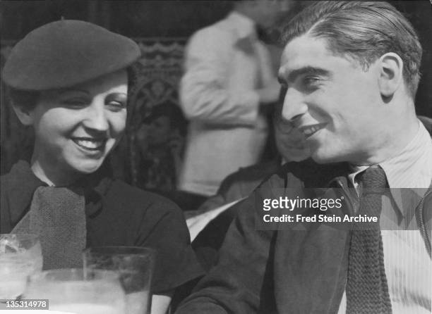 Portrait of photographers Gerda Taro and Robert Capa , 1936.