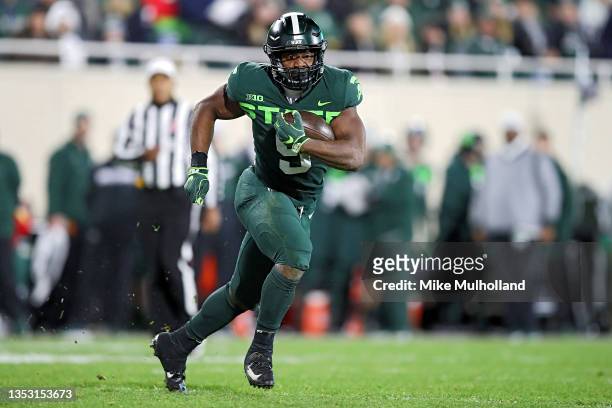 Kenneth Walker III of the Michigan State Spartans runs up the field in the second half against the Maryland Terrapins at Spartan Stadium on November...