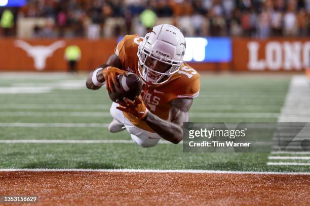 Marcus Washington of the Texas Longhorns catches a pass for a touchdown in overtime against the Kansas Jayhawks at Darrell K Royal-Texas Memorial...