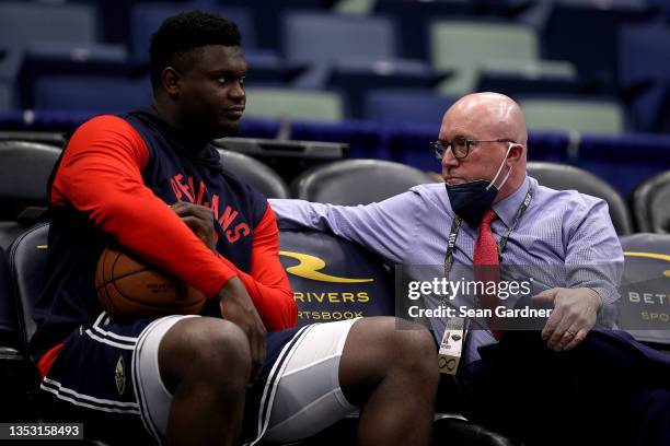 Zion Williamson of the New Orleans Pelicans speaks with David Griffin executive vice president of basketball operations for the New Orleans Pelicans...