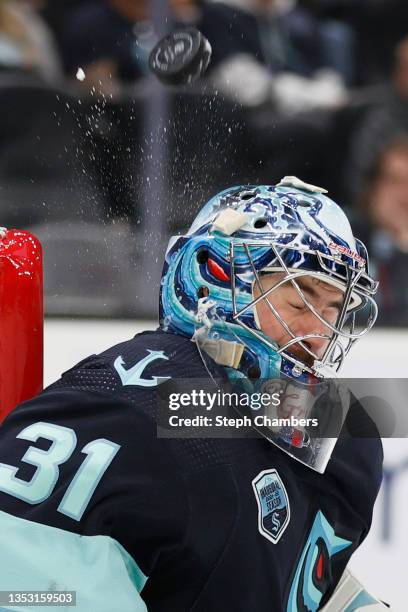 Philipp Grubauer of the Seattle Kraken makes a save against the Minnesota Wild during the third period on November 13, 2021 at Climate Pledge Arena...