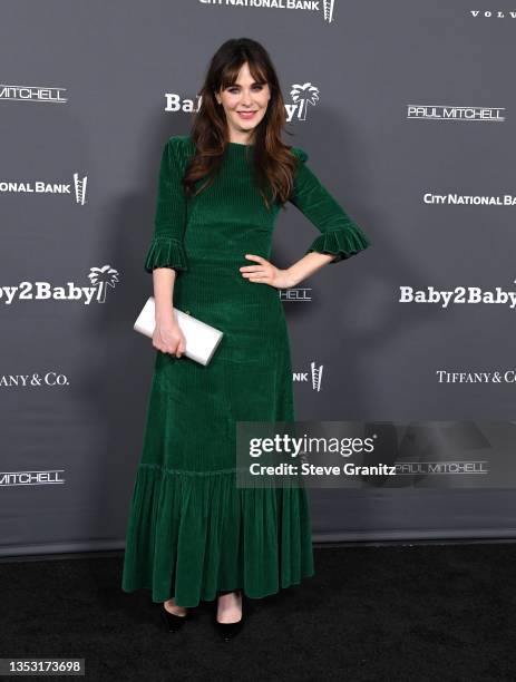 Zooey Deschanel arrives at the Baby2Baby 10-Year Gala Presented By Paul Mitchell at Pacific Design Center on November 13, 2021 in West Hollywood,...