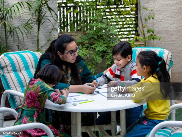 children studying in home 7 - pakistan stock pictures, royalty-free photos & images