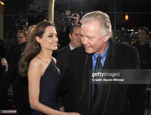 Writer/director Angelina Jolie and actorJon Voight arrive at the premiere of FilmDistrict's "In the Land of Blood and Honey" held at ArcLight Cinemas...