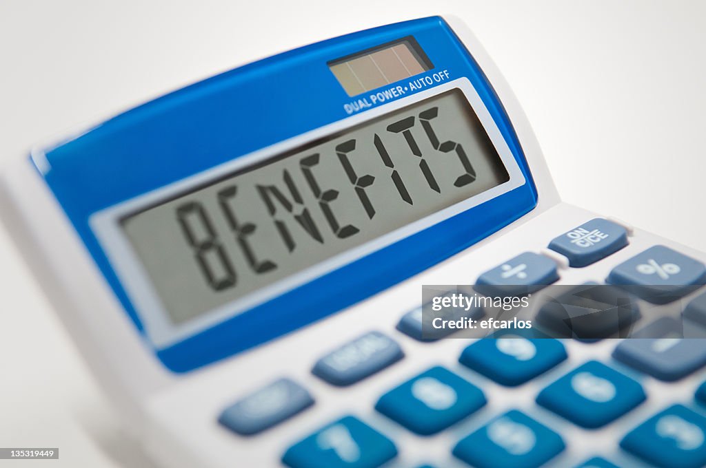 Calculator typing the word benefits