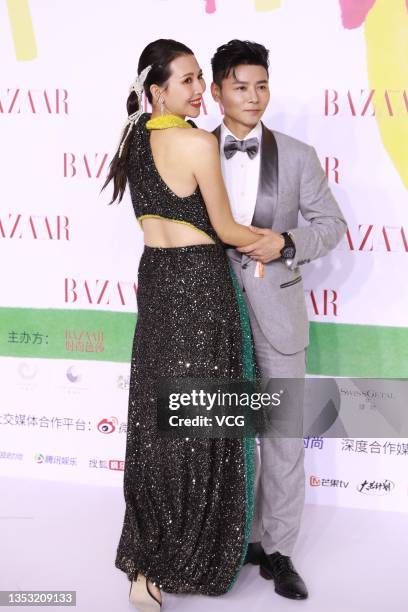 Actress Ada Choi Siu-fan and her husband Max Zhang Jin pose at red carpet of 2021 Bazaar Star Charity Night on November 13, 2021 in Shenzhen,...