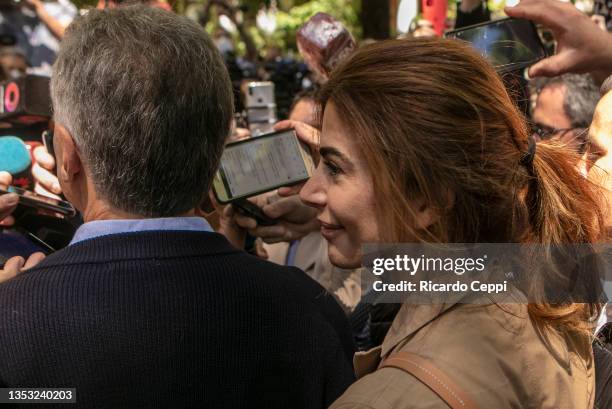 Juliana Awada walks with husband former president of Argentina Mauricio Macri as they leave after casting their vote during legislative midterm...