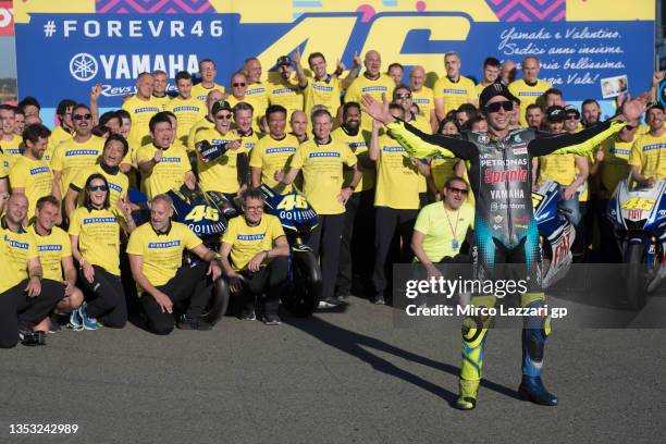 Valentino Rossi of Italy and Petronas Yamaha SRT celebrates his final race on the track with the Yamaha team at the end of the MotoGP race during the...