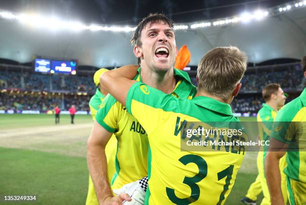 Mitchell Marsh and David Warner of Australia celebrate following the ICC Men's T20 World Cup final match between New Zealand and Australia at Dubai...