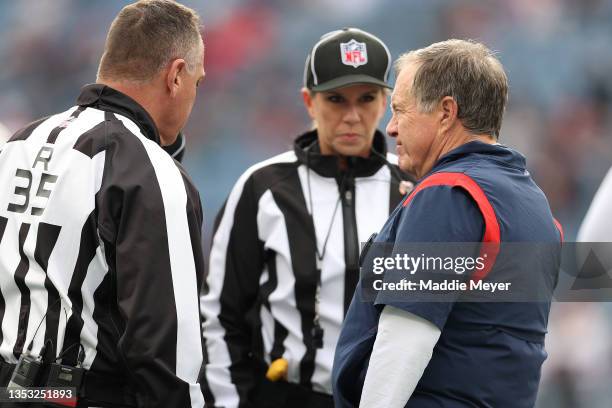 Head Coch Bill Belichick of the New England Patriots speaks with referee John Hussey and line judge Sarah Thomas before the game against the...