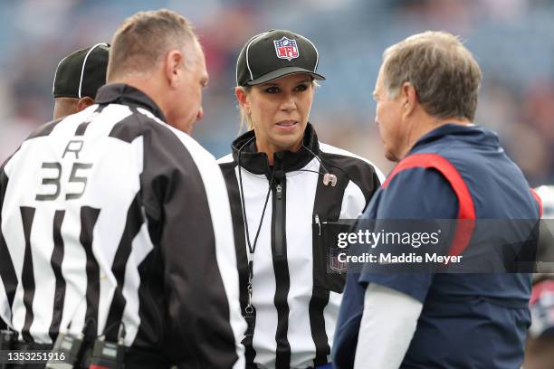 Head Coch Bill Belichick of the New England Patriots speaks with referee John Hussey and line judge Sarah Thomas before the game against the...