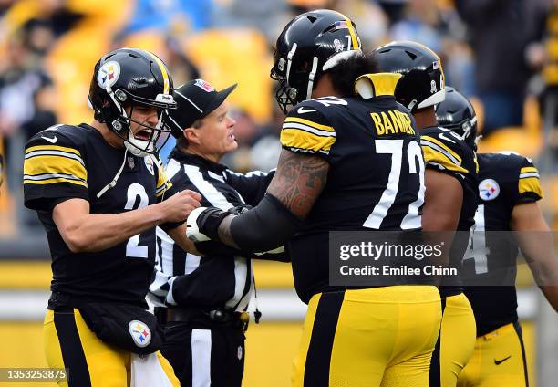 Mason Rudolph of the Pittsburgh Steelers fist bumps Zach Banner during warm ups prior to the game against the Detroit Lions at Heinz Field on...