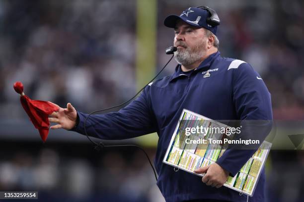 Head Coach Mike McCarthy of the Dallas Cowboys throws the red challenge flag to protest a reception during the first quarter against the Atlanta...