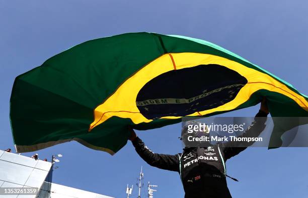 Race winner Lewis Hamilton of Great Britain and Mercedes GP celebrates in parc ferme during the F1 Grand Prix of Brazil at Autodromo Jose Carlos Pace...