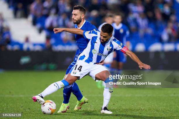 Recio of CD Leganes battles for the ball with Borja Baston of Real Oviedo during the LaLiga Smartbank match between CD Leganes and Real Valladolid CF...