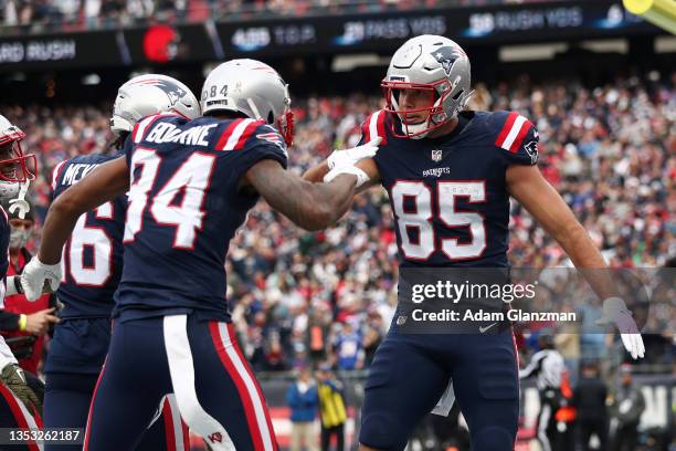 Hunter Henry of the New England Patriots celebrates his touchdown with Kendrick Bourne during the first quarter against the Cleveland Browns at...