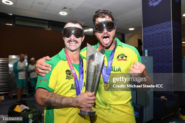 Matthew Wade and Marcus Stoinis of Australia pose with the ICC Men's T20 World Cup Trophy following the ICC Men's T20 World Cup final match between...