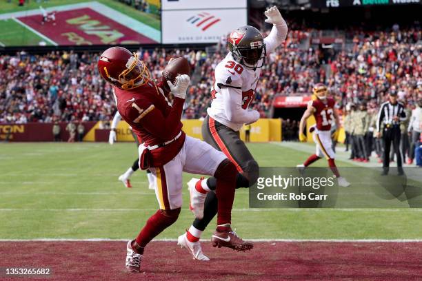 DeAndre Carter of the Washington Football Team catches the ball for a touchdown as Dee Delaney of the Tampa Bay Buccaneers defends during the first...